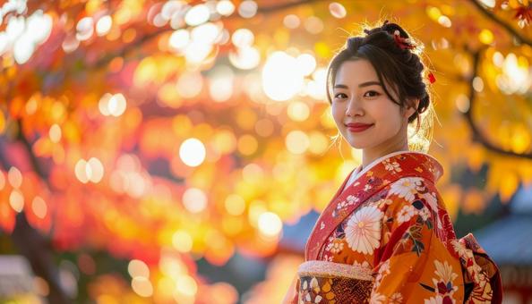 紅葉を眺める晴れ着姿の女性のポートレートの写真