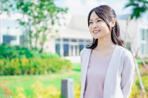 Business woman walking outside, JPG