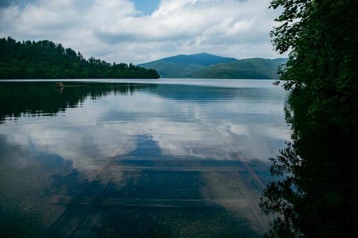 Rails and canoe submerged in lake, lake, line, rail, JPG