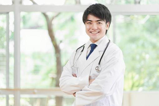 Male doctor working in a hospital, un uomo, un medico, un medico, JPG