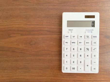 White calculator on a wooden table, JPG White calculator on a wooden table, JPG