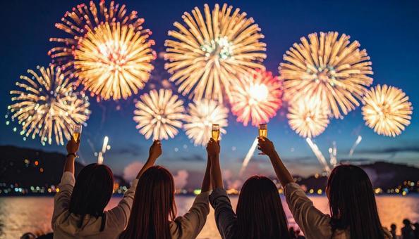 打ち上げ花火と乾杯する女性の写真