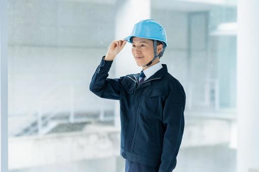 作業服のビジネスマン 作業服のビジネスマン 作業服,笑顔,管理の写真素材