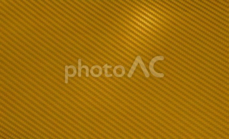 光沢の有る金色のカーボンファイバーの背景画像 背景,金,金色の写真素材
