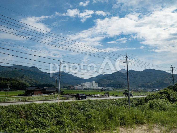 田舎の風景 (山口県山口市黒川 山口小郡秋穂線) 風景,空,電気の写真素材
