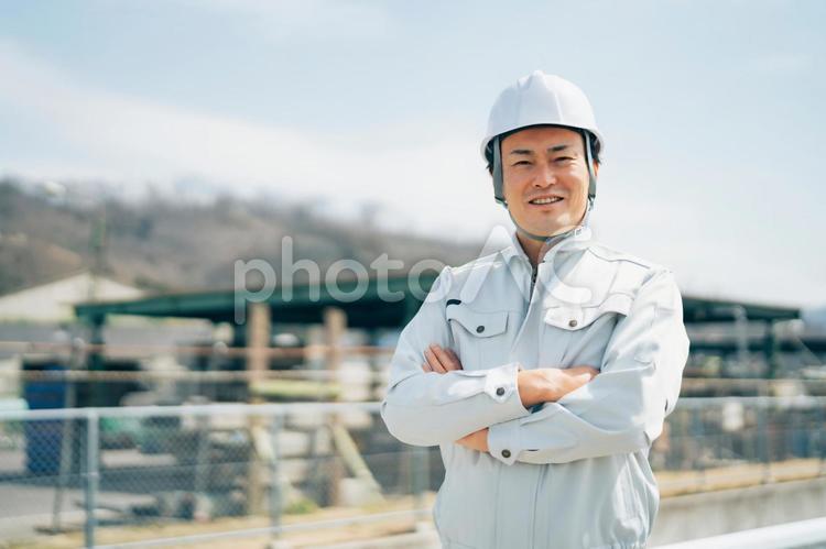 足場工事・建築業・作業着を着た男性 足場,足場職人,解体業の写真素材