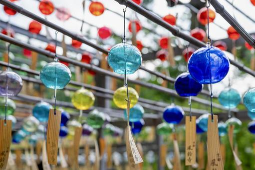 A traditional Japanese scene with glass wind chimes lined up, JPG A traditional Japanese scene with glass wind chimes lined up, JPG