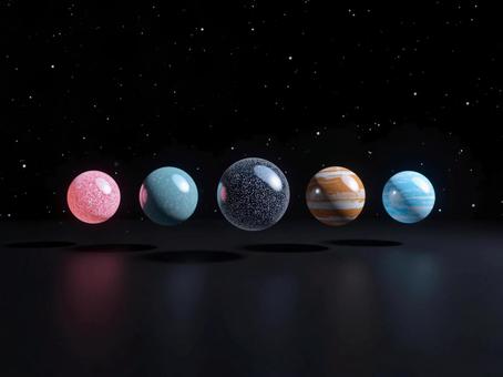 惑星の柄のガラス玉の写真