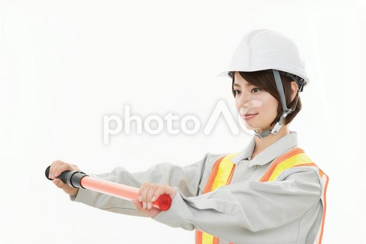 若い女性　土木作業員 警備員,土木作業員,誘導の写真素材
