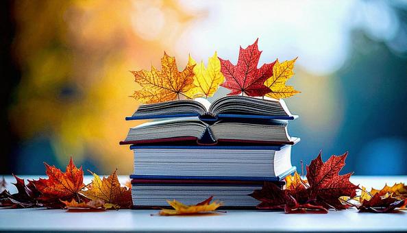 読書の秋 机の上の本 落ち葉の紅葉 読書の秋 机の上の本 落ち葉の紅葉の写真