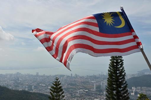 風にたなびくマレーシア国旗 風にたなびくマレーシア国旗 旗,空,フラッグの写真素材