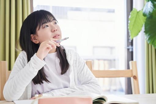 Japanese girls junior high school students thinking in the living room, middle school students, woman, japanese, JPG