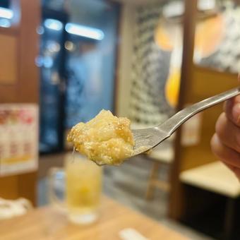 あつあつのもんじゃ焼きで至福のひとときの写真