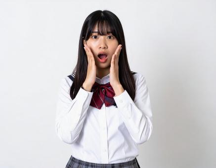 驚いた表情の女子生徒のイメージ 驚いた表情の女子生徒のイメージの写真