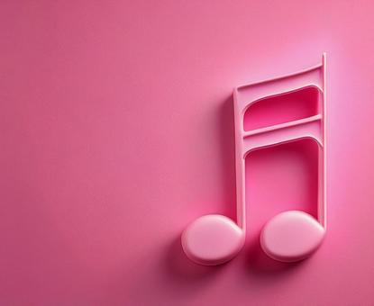 ピンク色の背景に飾られた音符の写真
