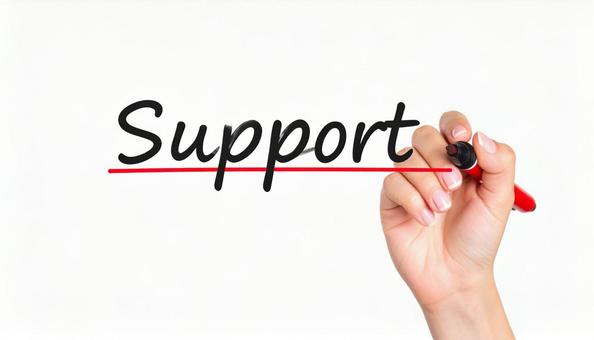 文字「Support」と赤ペンで書く手元の写真