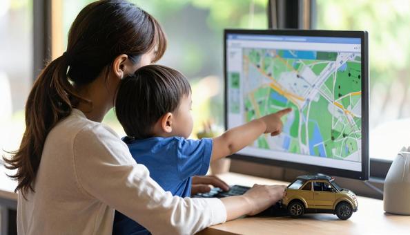 A mother working remotely and looking at a computer with her child, computer, screen, child, JPG