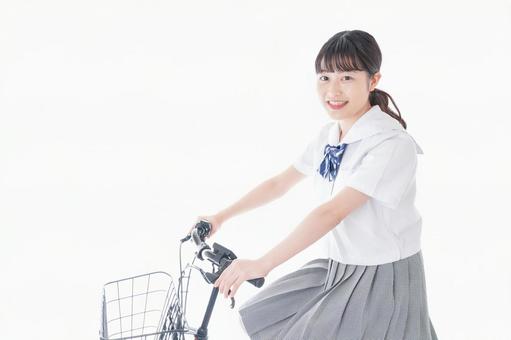 自転車通学をする若い女子学生 自転車通学をする若い女子学生 笑顔,ルール,運転ルールの写真素材