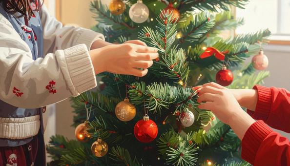 クリスマスツリーの飾りつけをする子ども クリスマスツリーの飾りつけをする子どもの写真