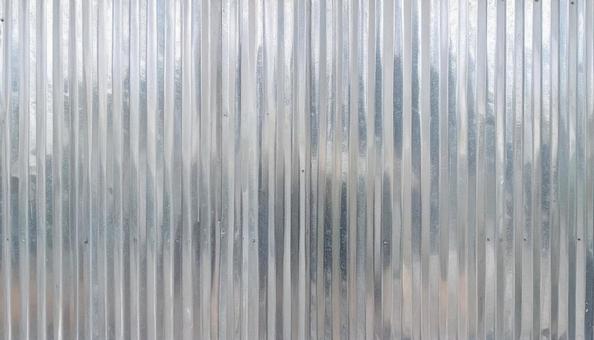 シルバーの波板金属の背景の写真