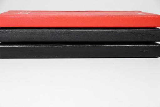 Red and black leather notebook with blank space at the bottom, JPG