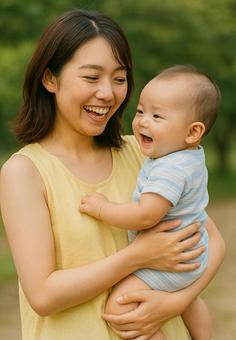 赤ちゃんを抱っこする女性 赤ちゃんを抱っこする女性の写真