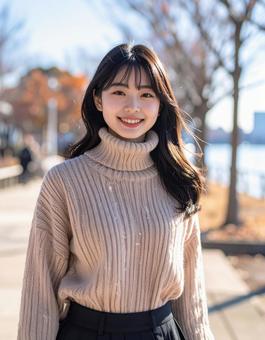 冬・セーター姿の彼女は笑顔 冬・セーター姿の彼女は笑顔の写真