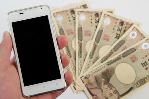 スマートフォンとお金のイメージ スマートフォンとお金のイメージ スマートフォン,携帯電話,お金の写真素材
