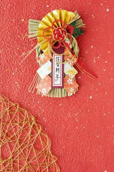  赤色背景の謹賀新年のしめ飾り 謹賀新年,しめ飾り,和紙の写真素材
