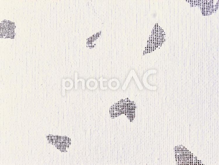 小さい穴が無数に空いた白い壁 穴,絵の具,背景の写真素材