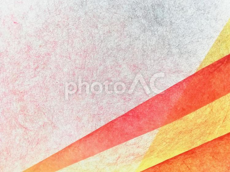 和紙　淡い赤色に重ねた黄色と赤色リボン 和紙,紙,壁紙の写真素材