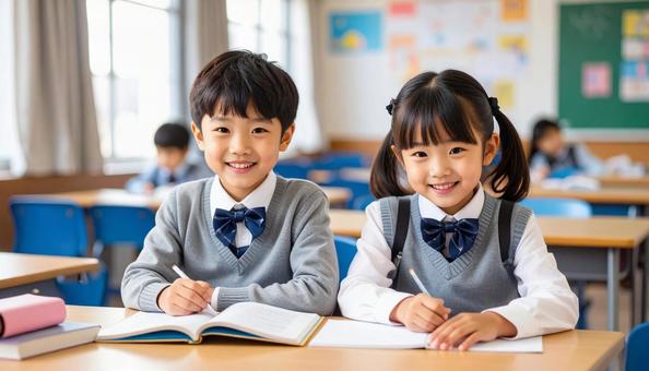 学校の教室で勉強している小学生2人 学校の教室で勉強している小学生2人の写真