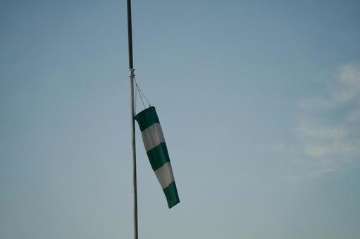 Green and white safety flag and blue sky, JPG Green and white safety flag and blue sky, JPG