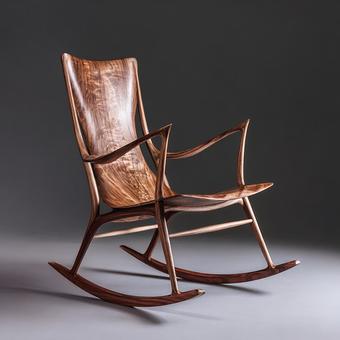 洗練されたデザインの木製ロッキングチェアの写真