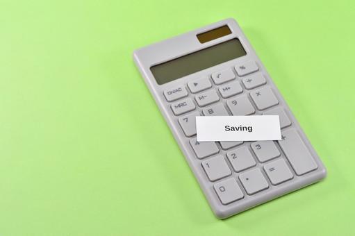 savingと電卓で節約のイメージ savingと電卓で節約のイメージ saving,節約,家計の写真素材