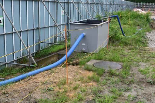 工事現場 工事現場 仮囲い,タンク,ホースの写真素材