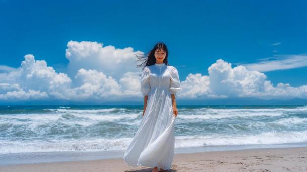 夏の青空と海と白い服の女性 夏の青空と海と白い服の女性の写真