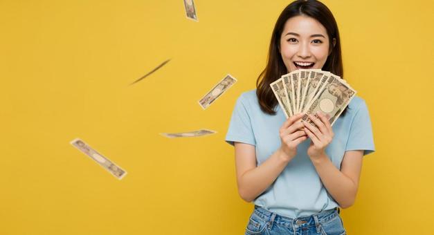 大金を手にして喜ぶ女性 大金を手にして喜ぶ女性の写真