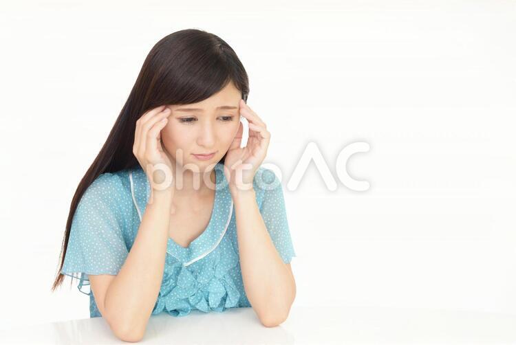 頭痛を訴える女性 頭痛,女性,女の写真素材
