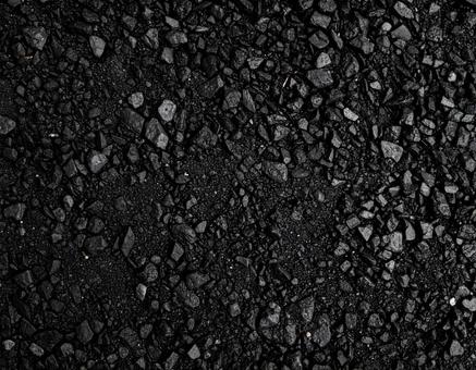 小石が混じった黒い道路のテクスチャ 小石が混じった黒い道路のテクスチャの写真