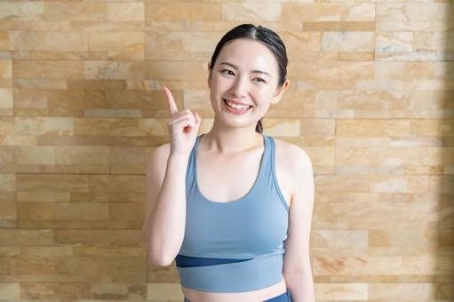指差しをする女性 ヨガ,フィットネス,ストレッチの写真素材