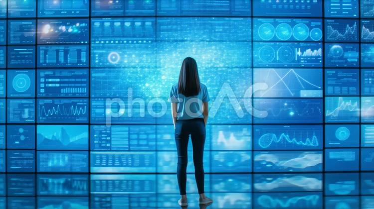 ディスプレーの前に立つ女性の後ろ姿 ai,ディスプレー,デジタルの写真素材