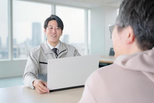 商談 作業服,作業員,男性の写真素材