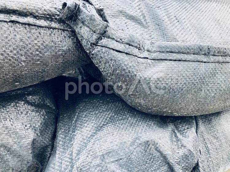 黒い土嚢袋背景 黒い,土嚢袋,珍しいの写真素材