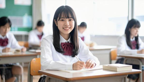 塾で勉強する笑顔の日本人の女の子 塾で勉強する笑顔の日本人の女の子の写真