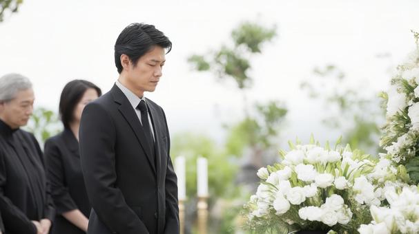 葬儀に参列する喪服姿の男性や家族 葬儀に参列する喪服姿の男性や家族の写真