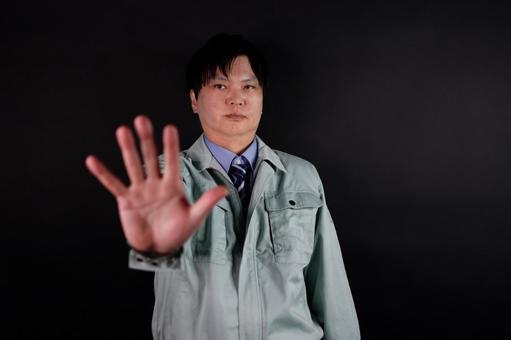 拒否のジェスチャーをする男性 拒否のジェスチャーをする男性の写真