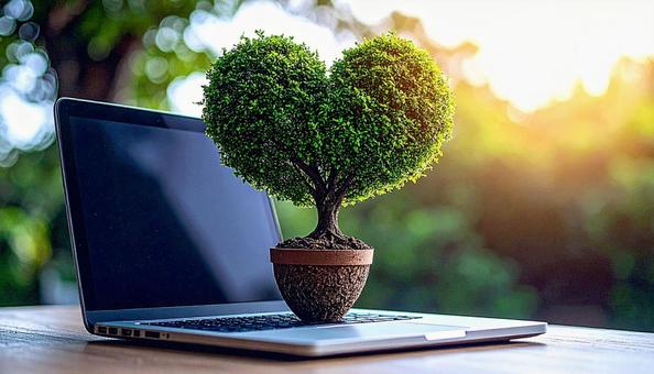 ハート型の小さな木とノートパソコン ハート型の小さな木とノートパソコンの写真