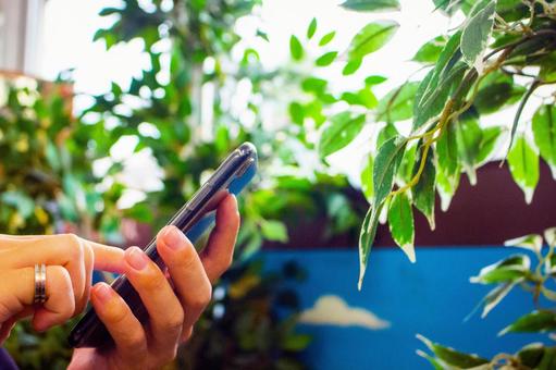 Hand holding a smartphone Hand holding a smartphone