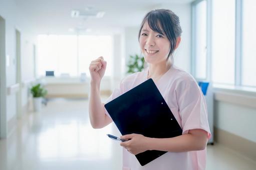 ガッツポーズする爽やかな医療女性 ガッツポーズする爽やかな医療女性 看護師,女性,医療従事者の写真素材